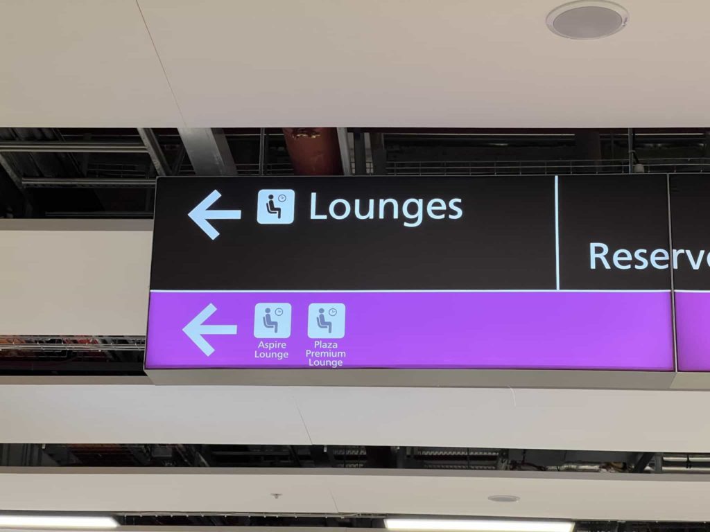 A sign within Edinburgh Airport, pointing towards the lounges at the North East side of the terminal